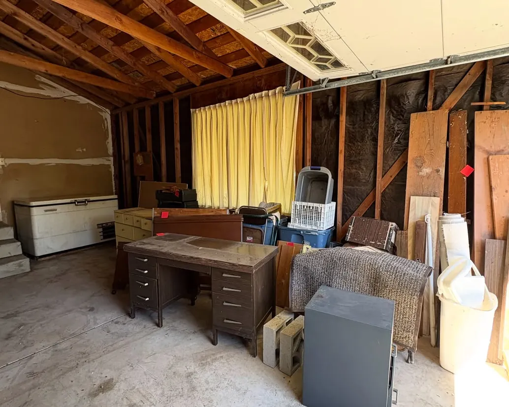 Cluttered interior of an older Adelaide property awaiting deceased estate clearance